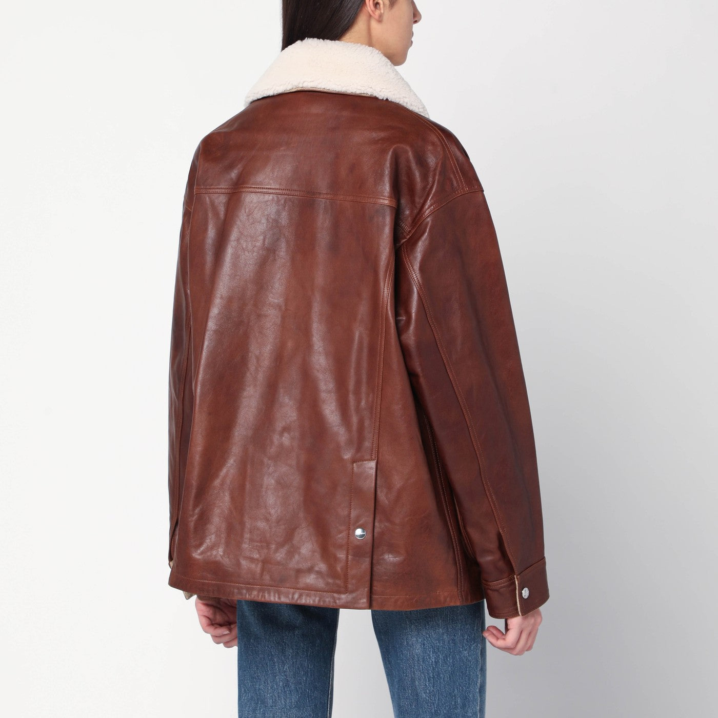 Giubbotto marrone in pelle con collo in shearling