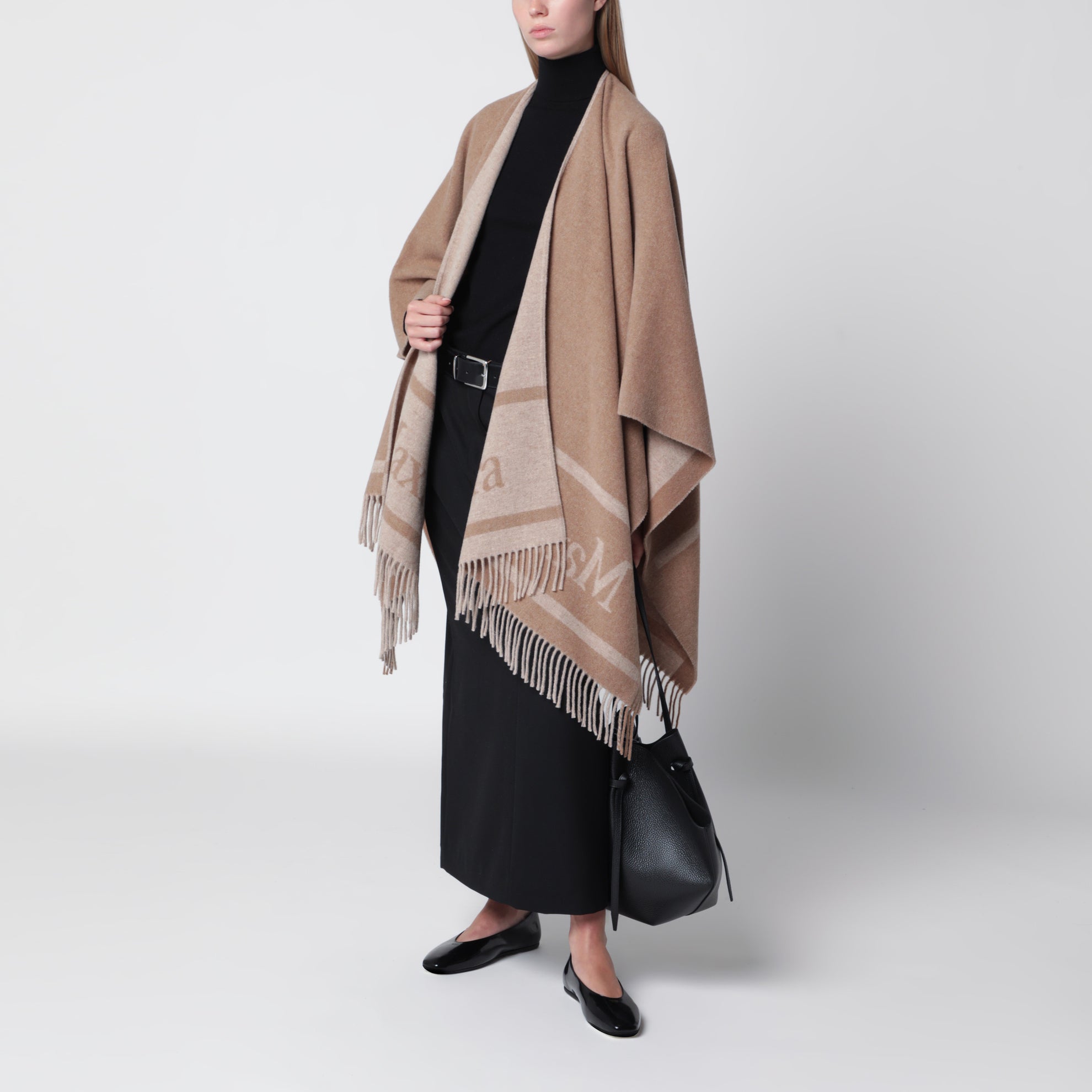 Jacquard poncho with fringes in sand-colored wool