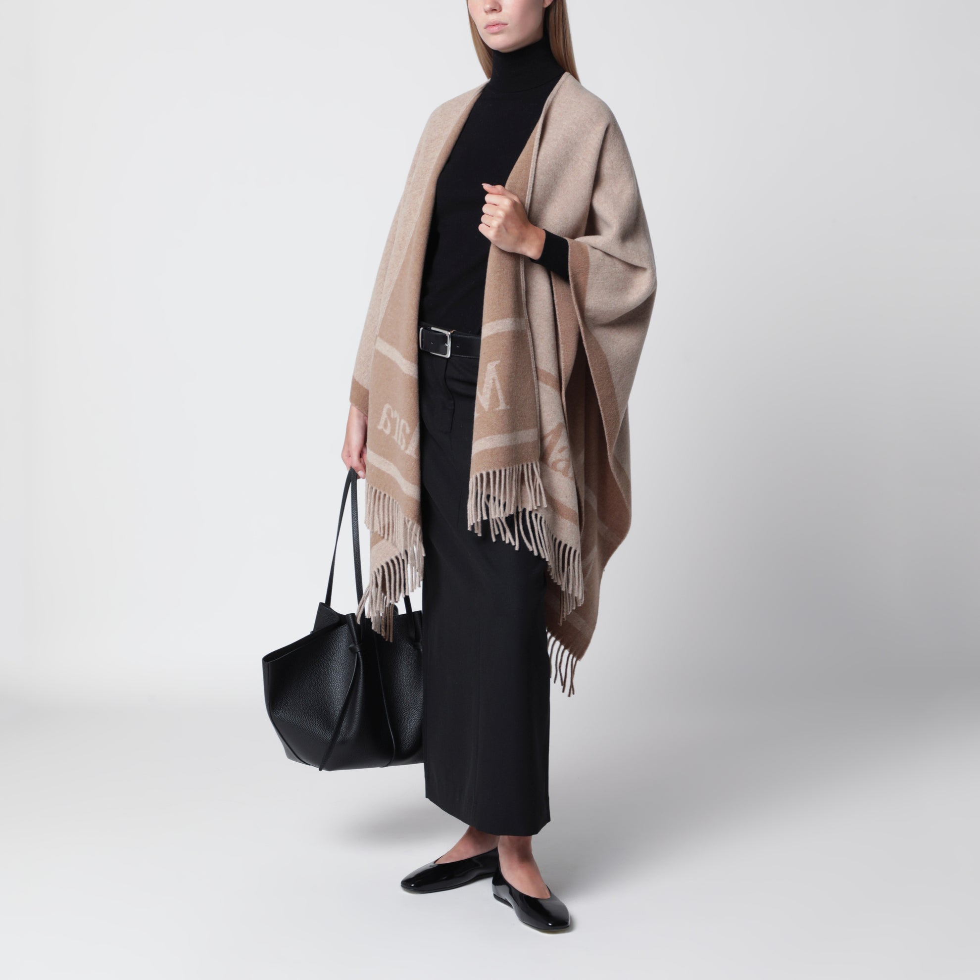 Jacquard poncho with fringes in sand-colored wool
