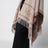 Jacquard poncho with fringes in sand-colored wool
