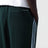 Dark green jogging trousers