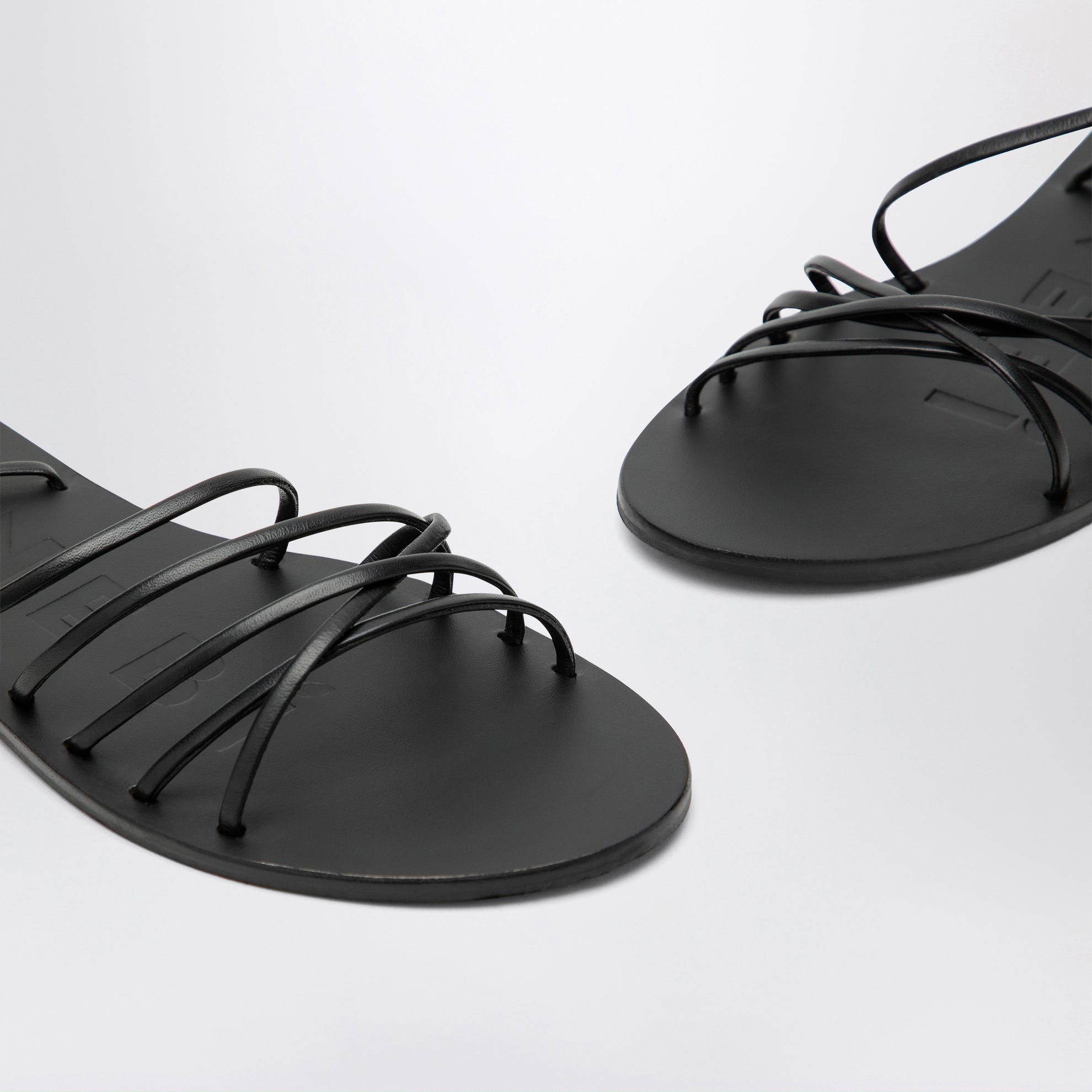 Black crossover leather sandals