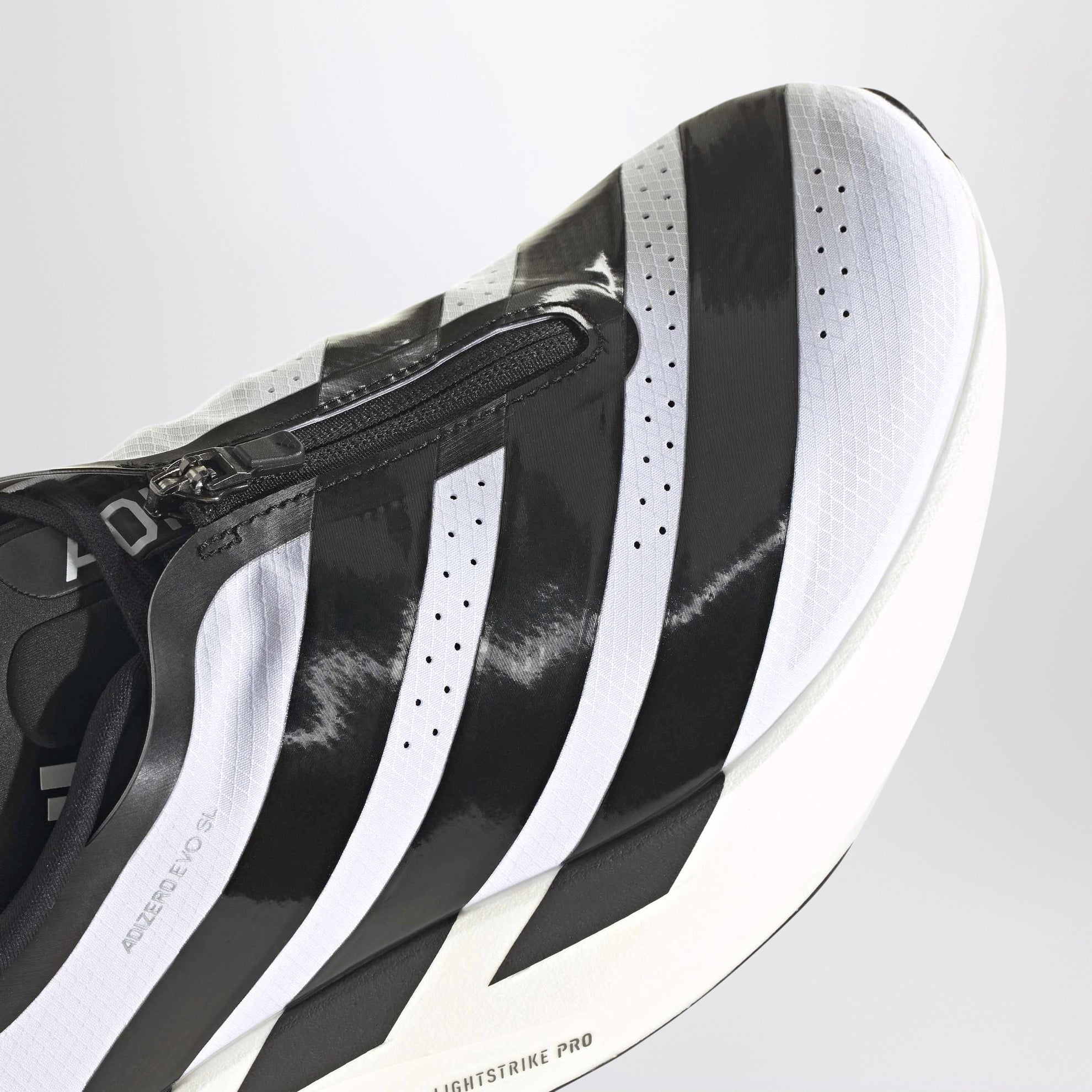 Sneakers adidas Adizero Evo SL Zip noires et blanches