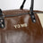 Brown/cream white leather bag with logo