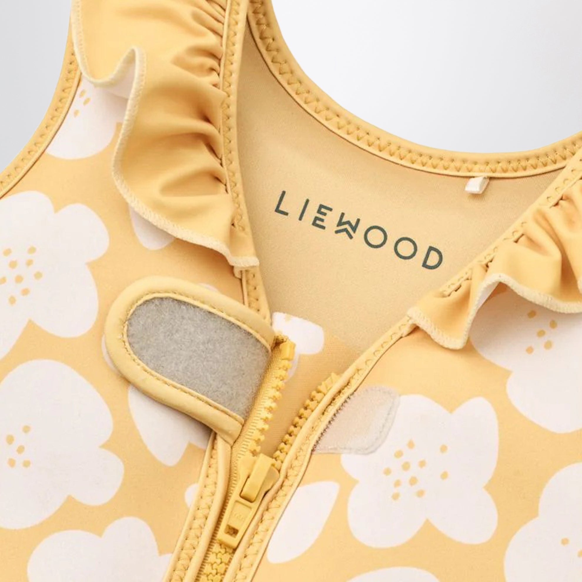 Gelbe Schwimmweste mit Blumenprint