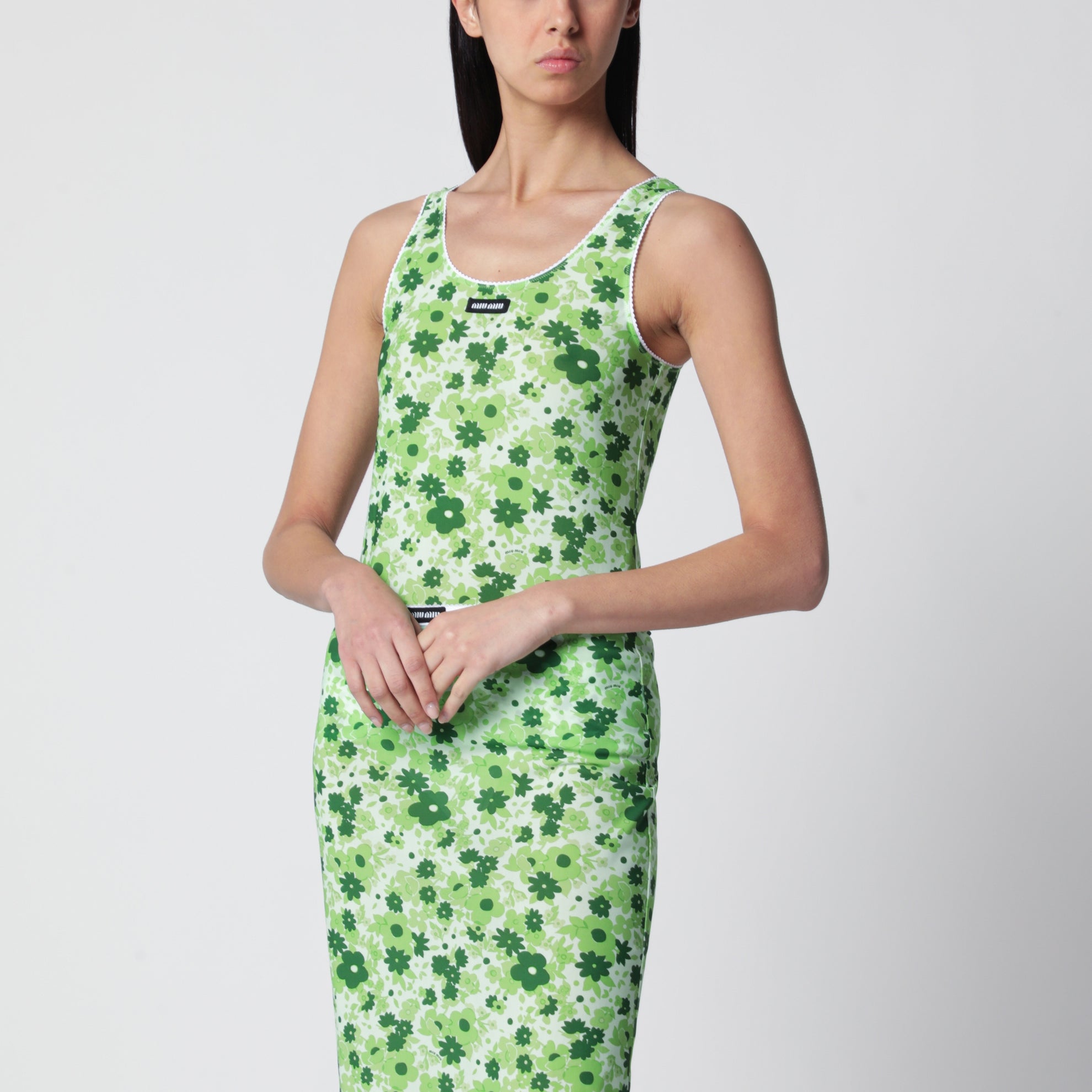 Top stretch verde con stampa fiori