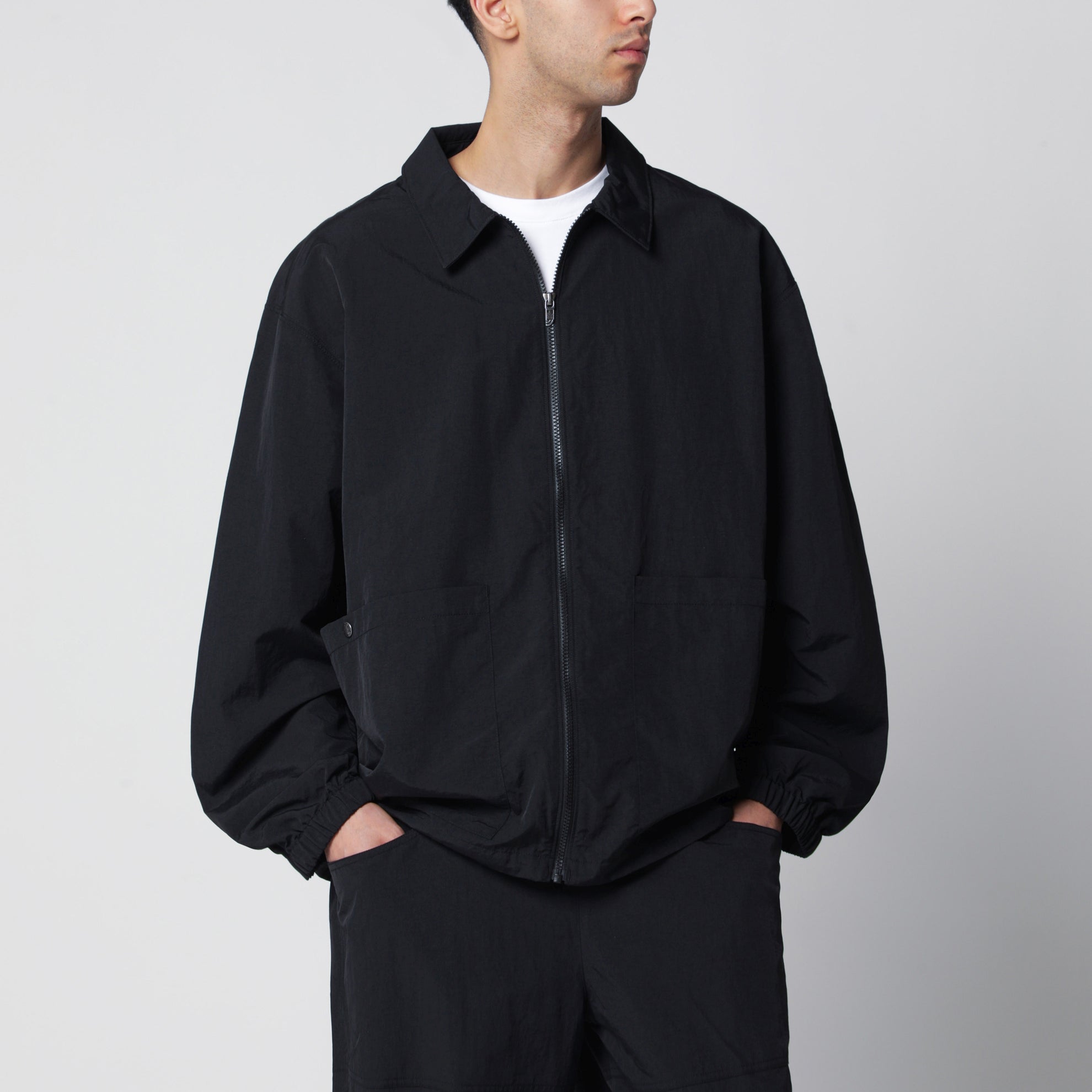 Black zip-up nylon jacket