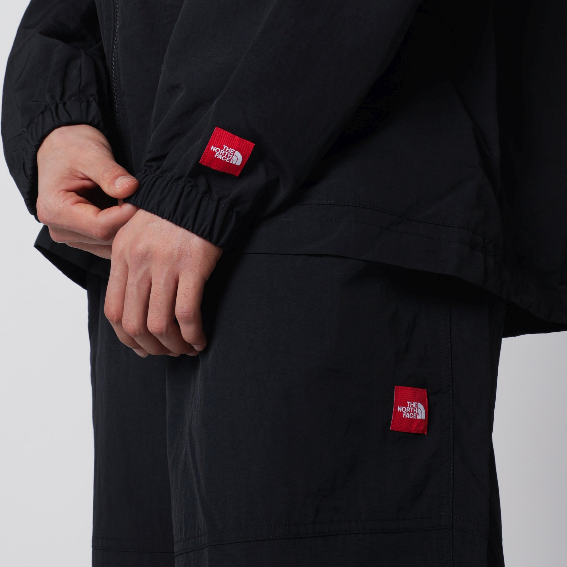 Black zip-up nylon jacket