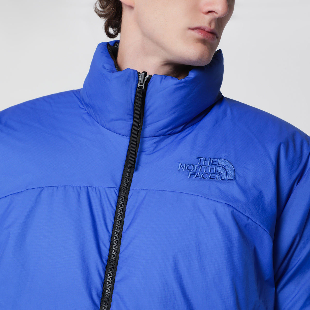 Blue and black reversible Nuptse jacket in nylon
