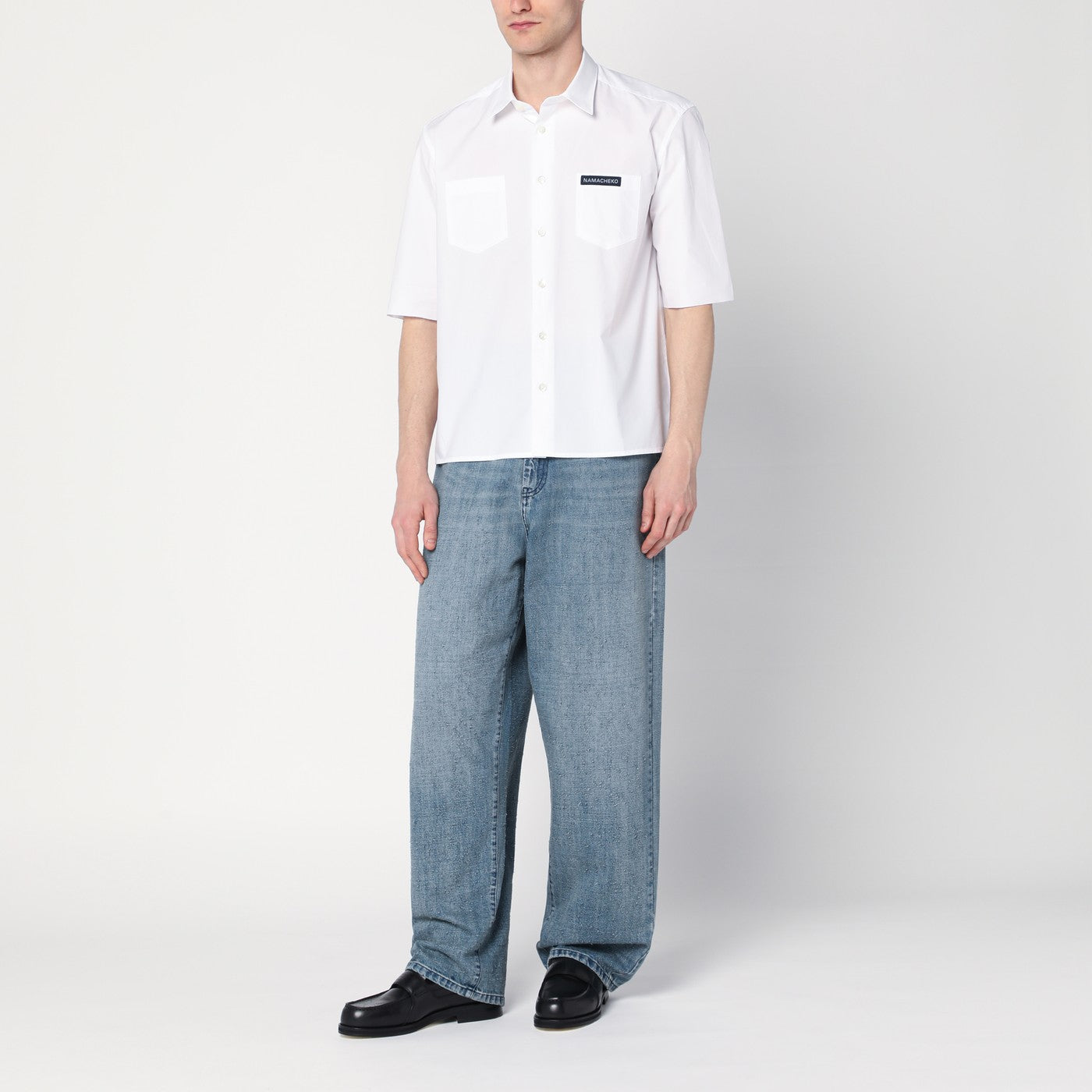 White shirt with logo patch