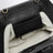 Sac à main sculptural en polyuréthane noir froncé