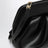 Sac à main sculptural en polyuréthane noir froncé