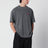 T-shirt nera slavata in cotone con logo