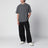 T-shirt nera slavata in cotone con logo