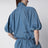 Volume blouson tied in blue cotton blend