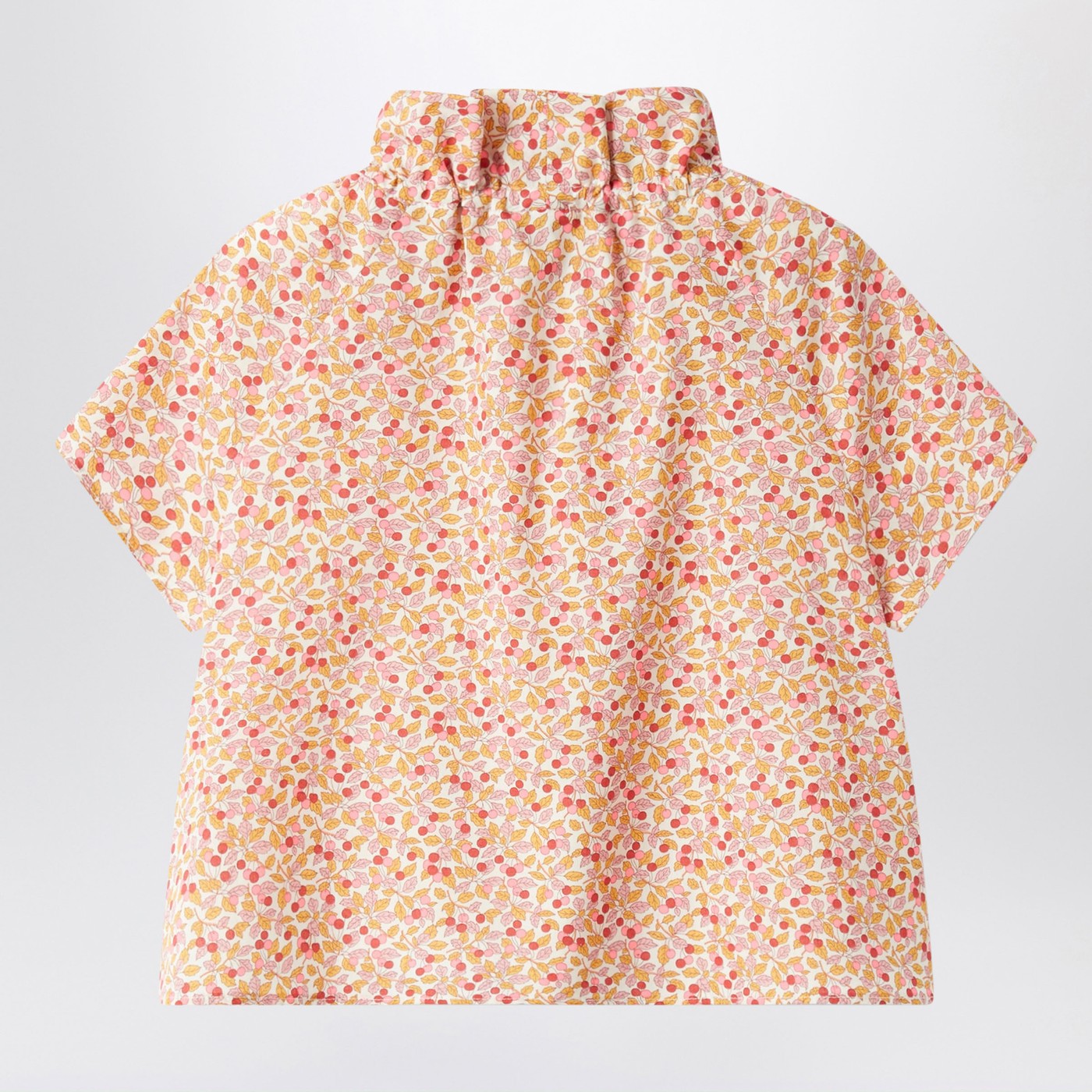 Apricot-coloured top with ruffled collar