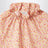 Apricot-coloured top with ruffled collar