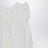 Barboteuse blanche avec broderies florales