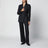 Black pinstripe wool-blend trousers