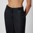 Black pinstripe wool-blend trousers