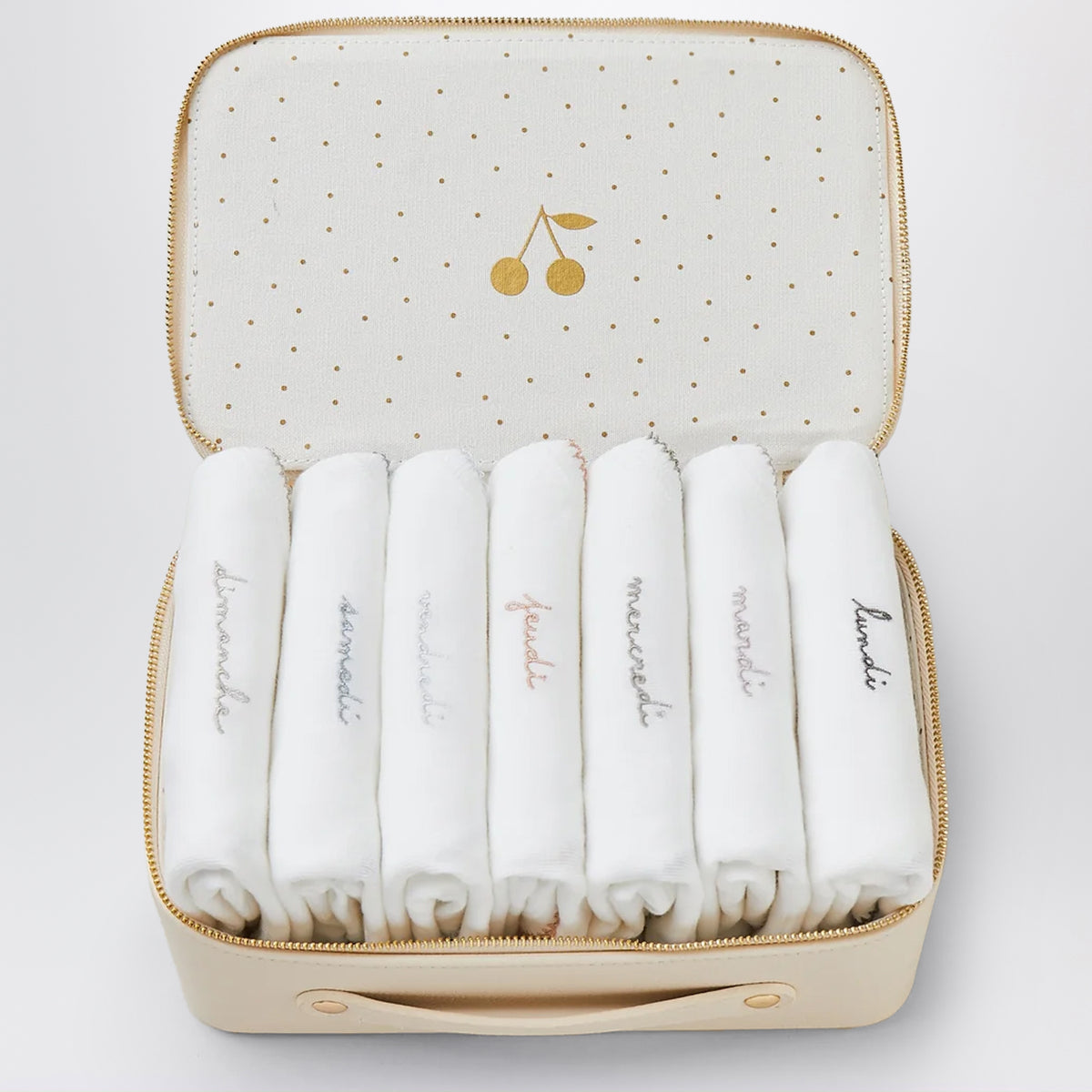 Weißer Koffer mit 7 bestickten Bodys