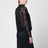 Camicetta in pizzo nera con scollo alto