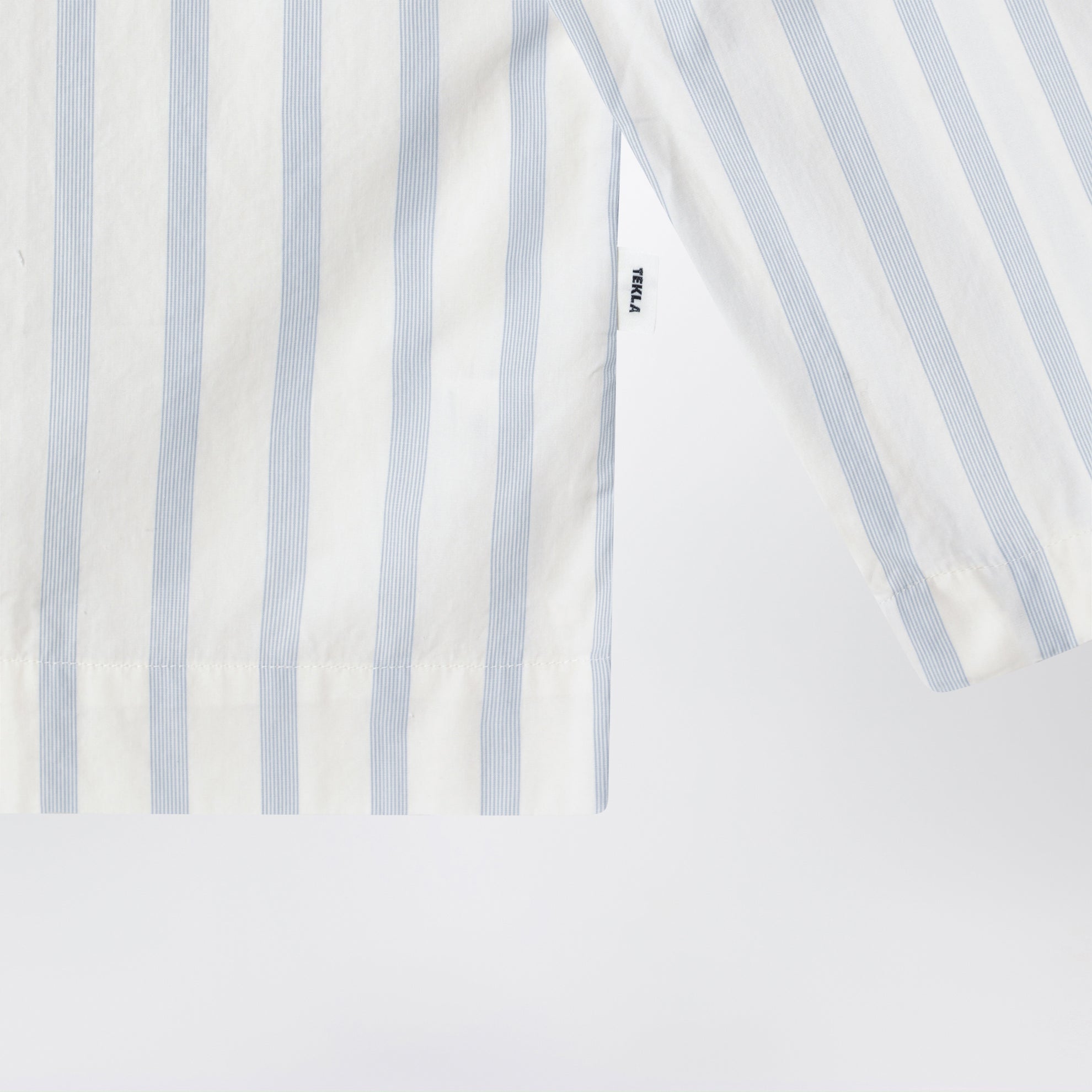 White pajama shirt with light blue stripes