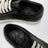 Vintage Sneakers in schwarzem Python- und Lammleder