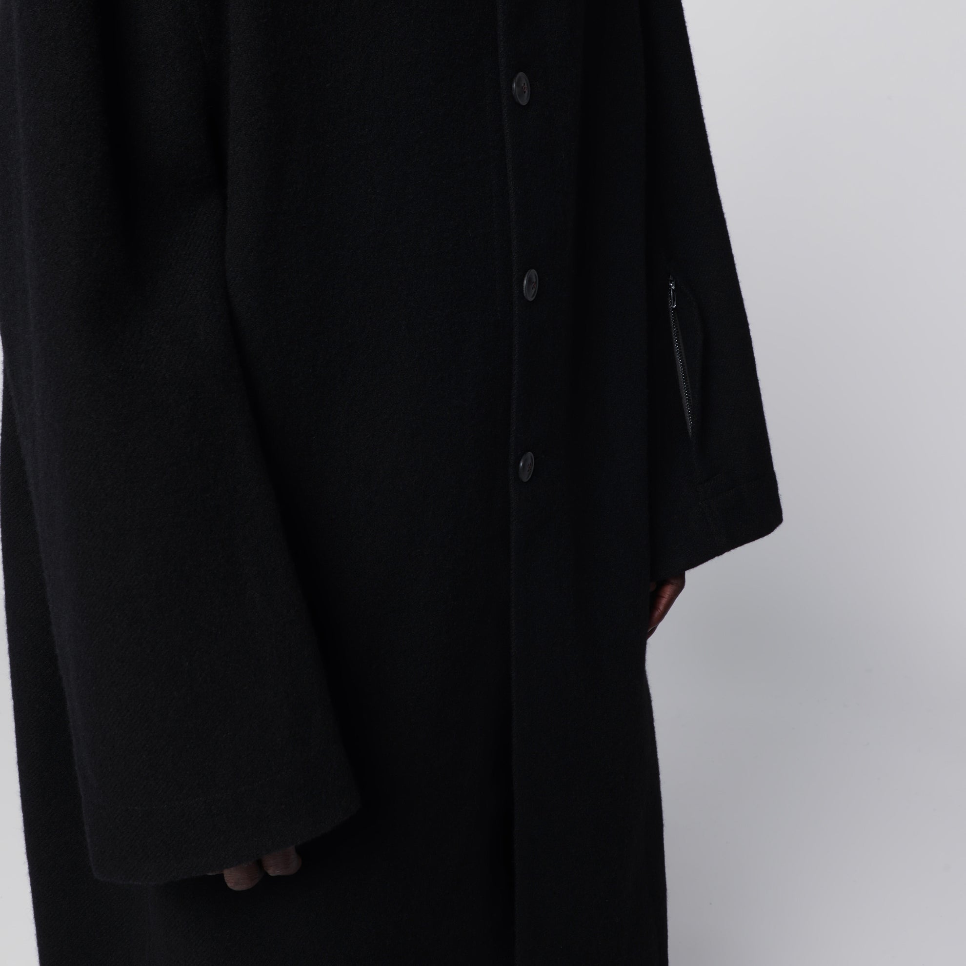 Long single-breasted virgin wool coat in black