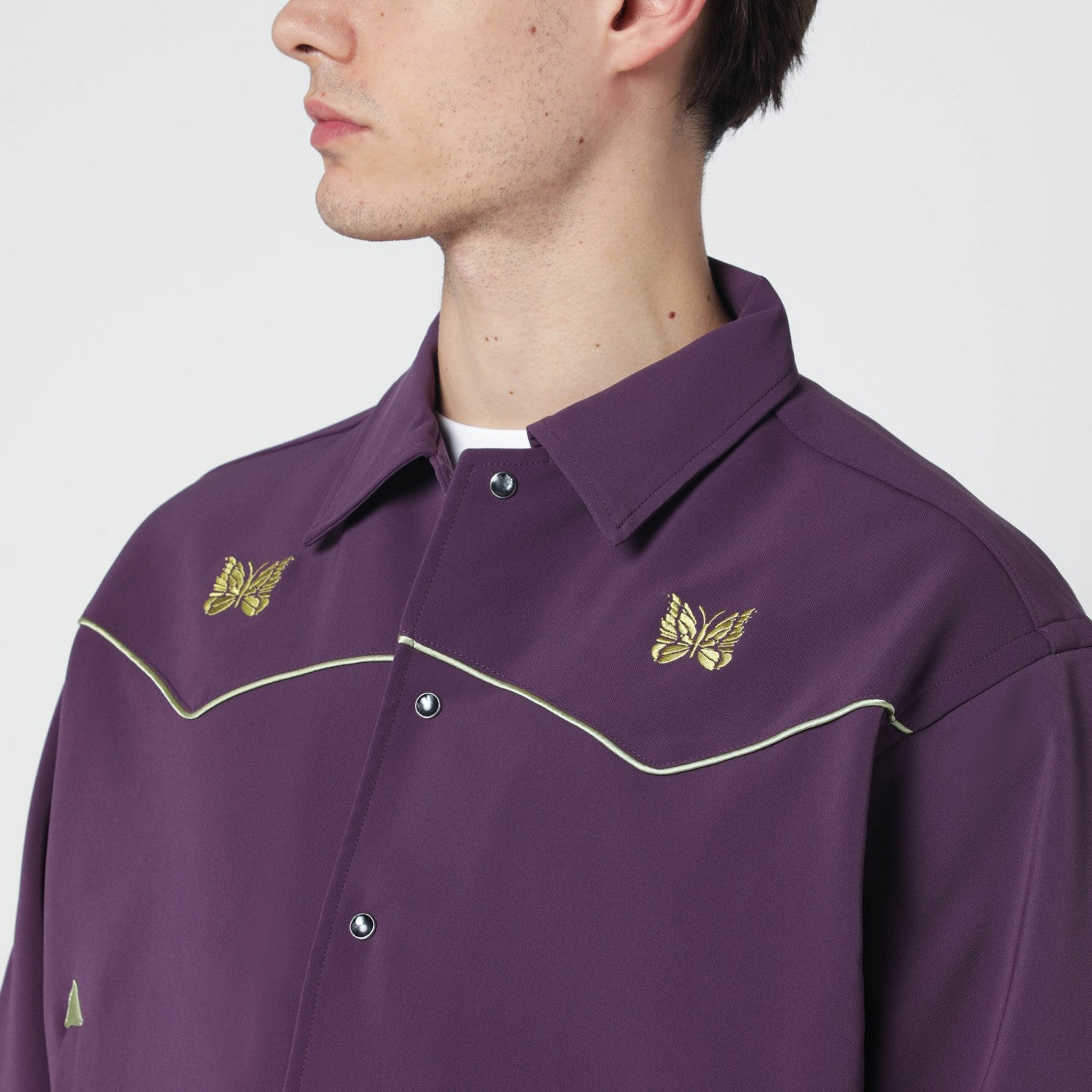 Purple shirt with yellow embroidery