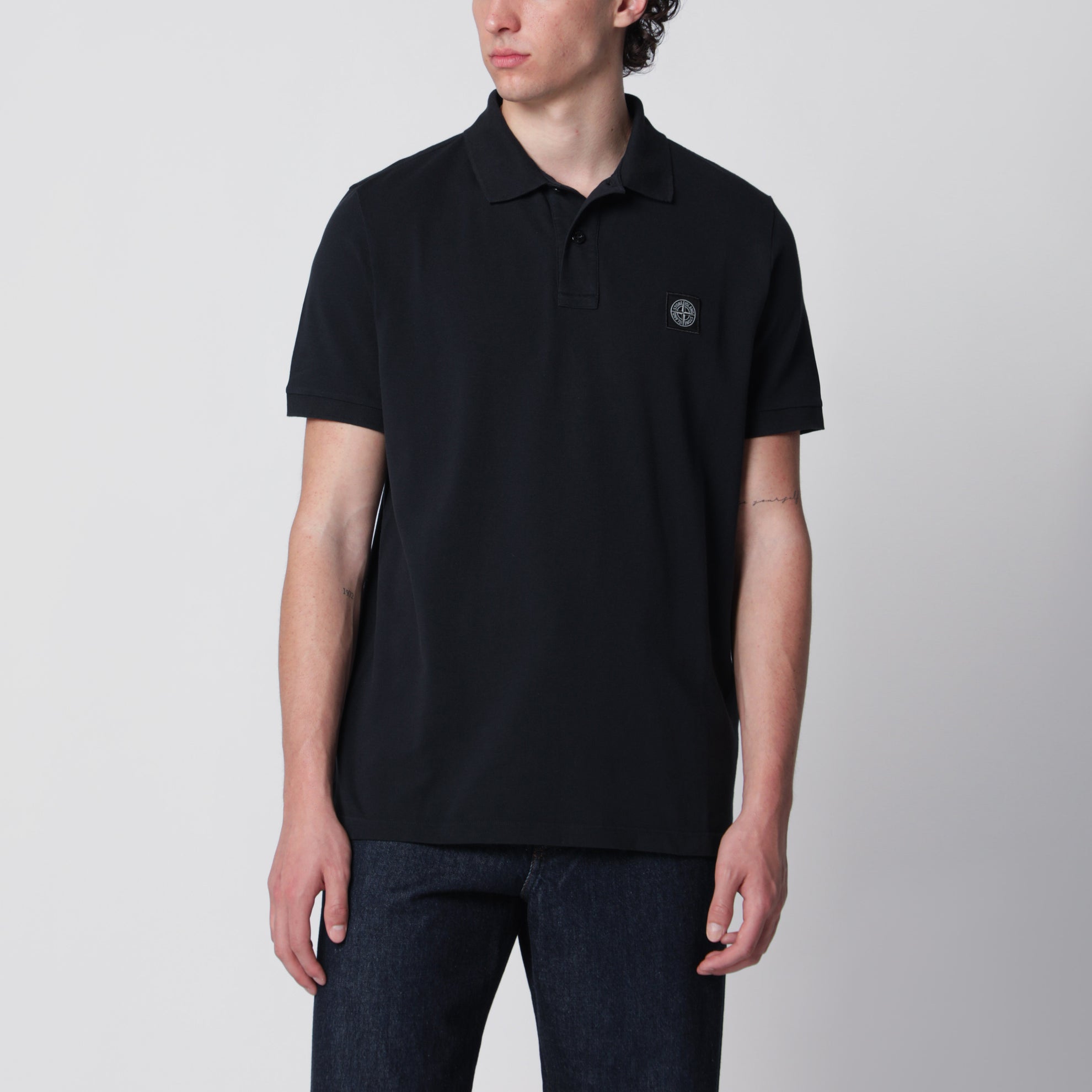 Navy blue polo with Compass logo patch