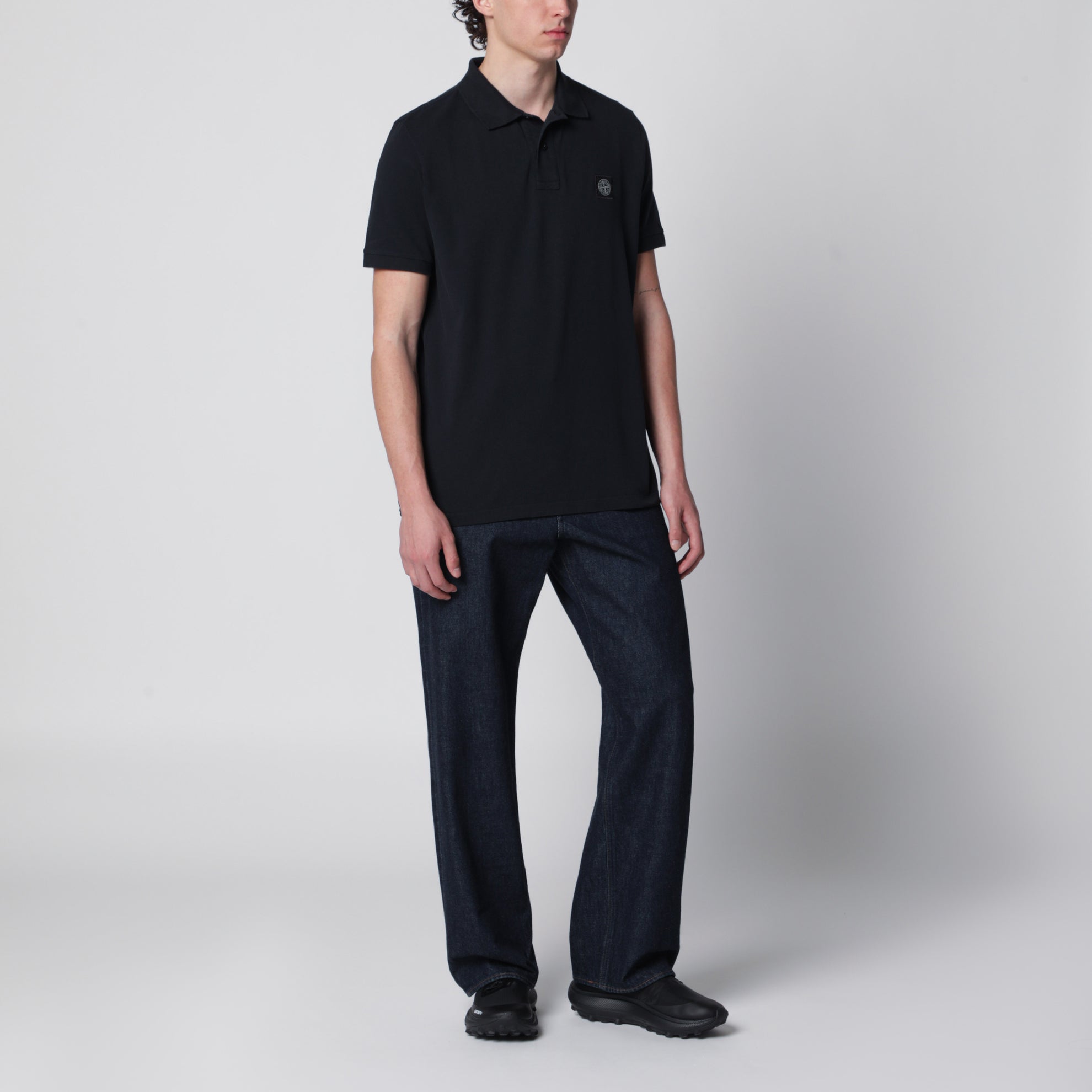 Navy blue polo with Compass logo patch