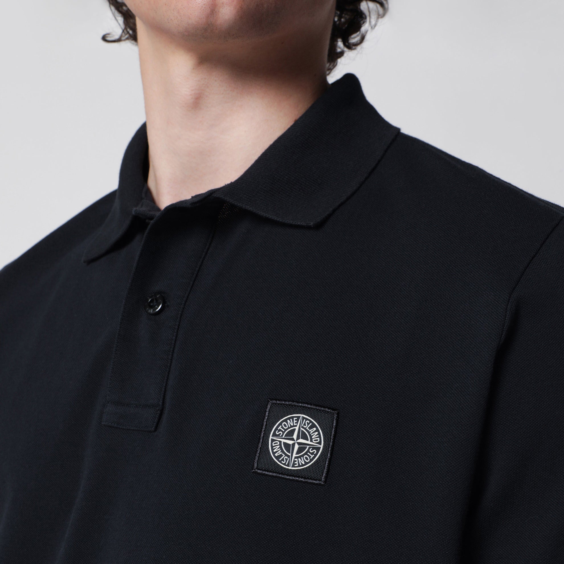 Navy blue polo with Compass logo patch