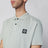 Polo color salvia con patch logo Compass