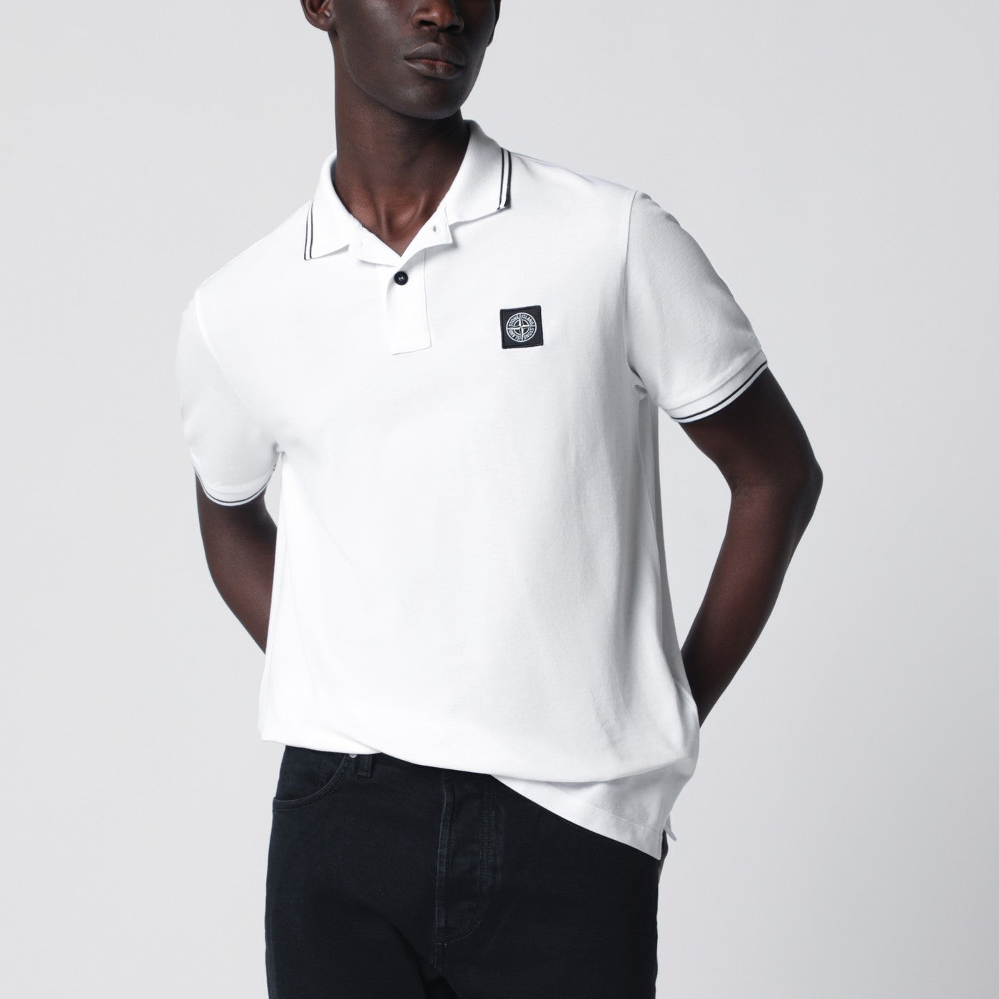 White polo shirt with Compass patch