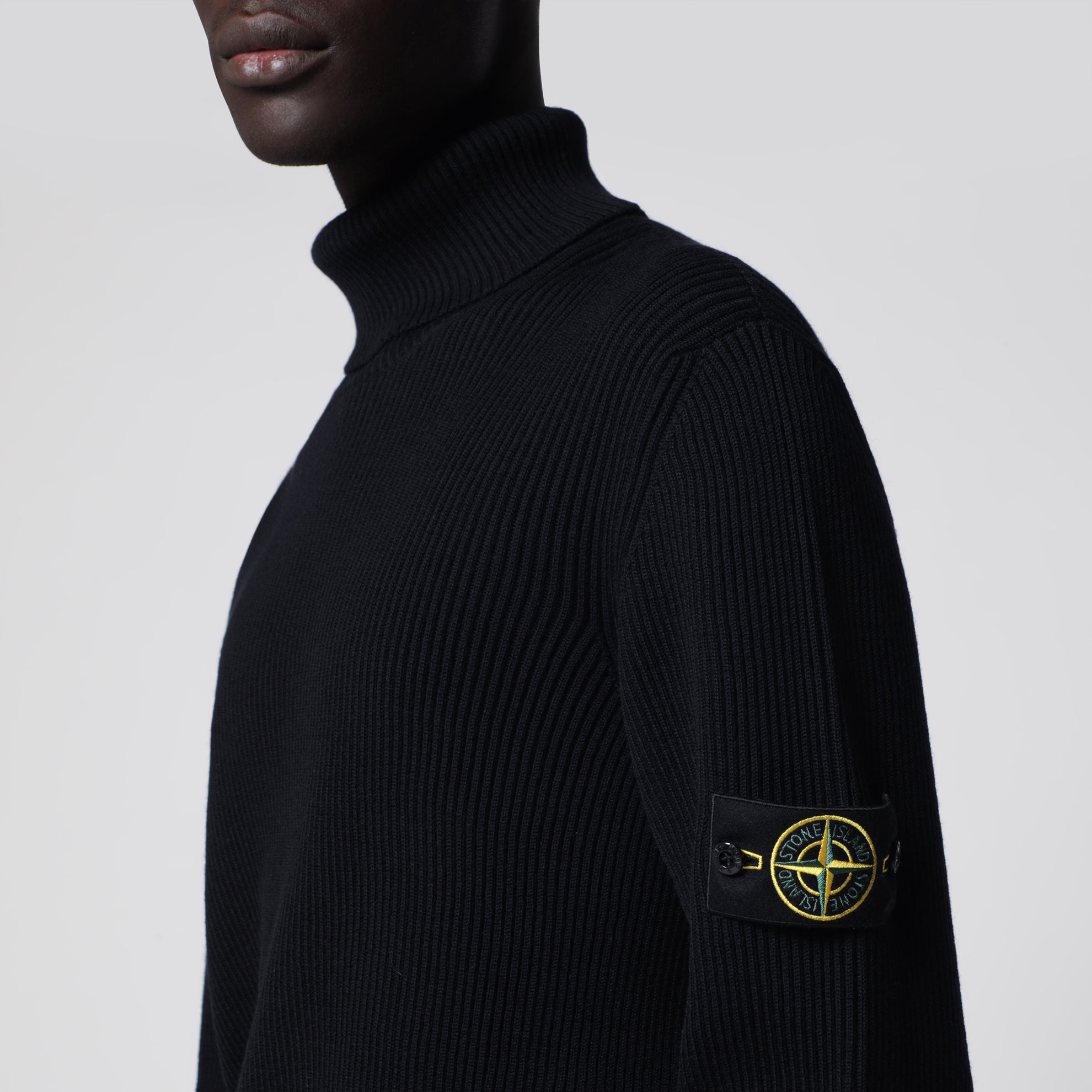 Navy blue ribbed turtleneck sweater