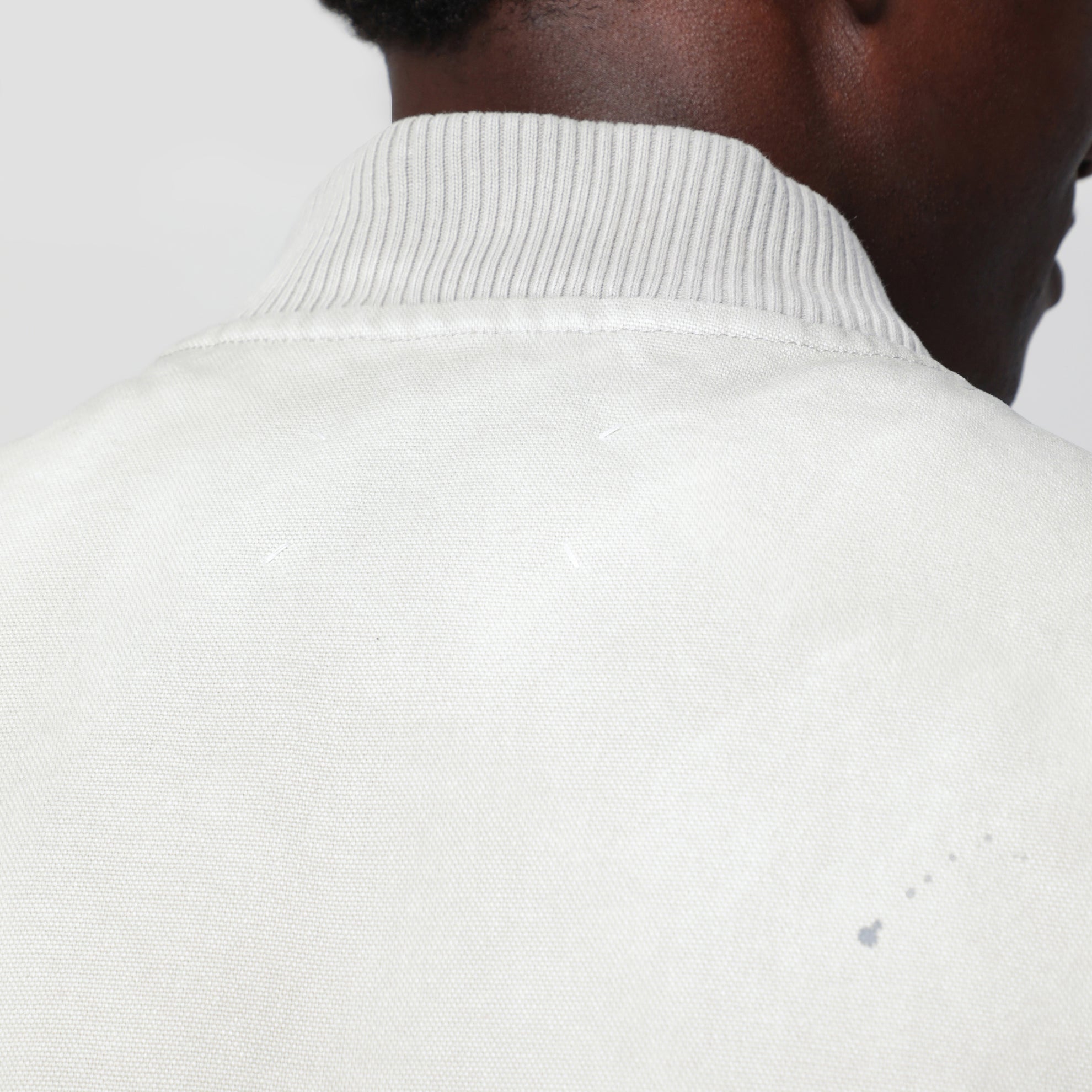 Vintage pearl grey vest with paint-effect details