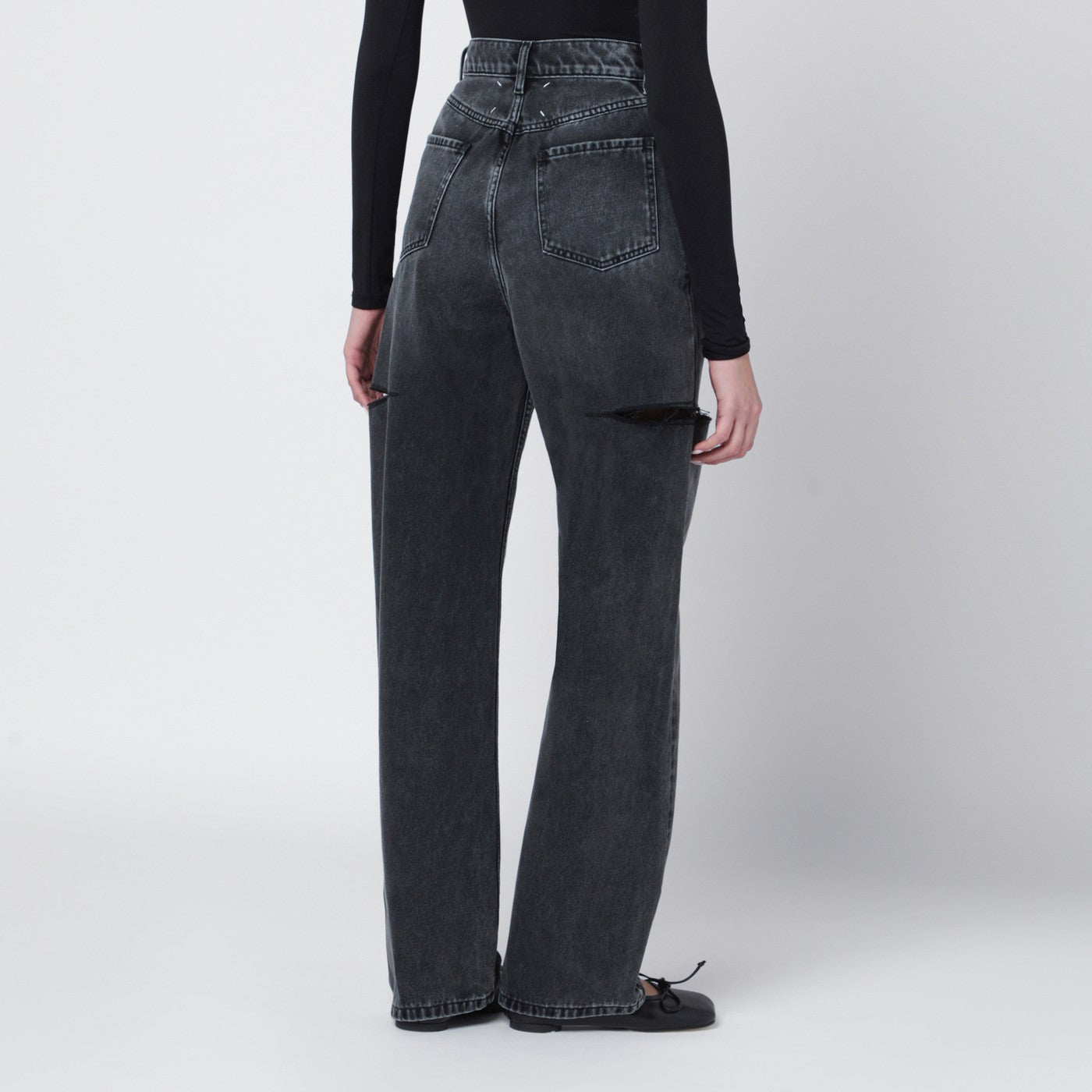 Washed black jeans with side rips