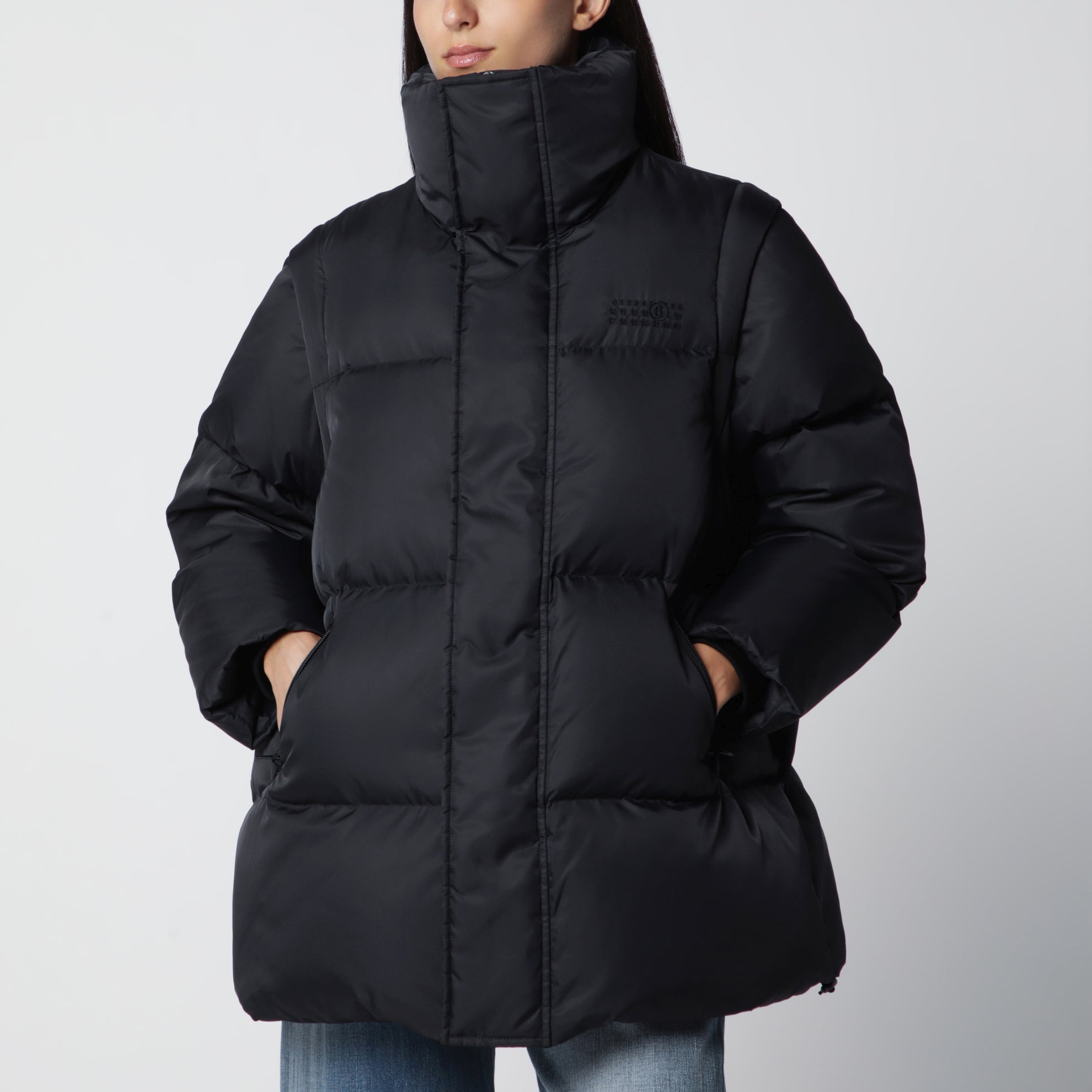 Nylon puffer jacket with detachable sleeves in black