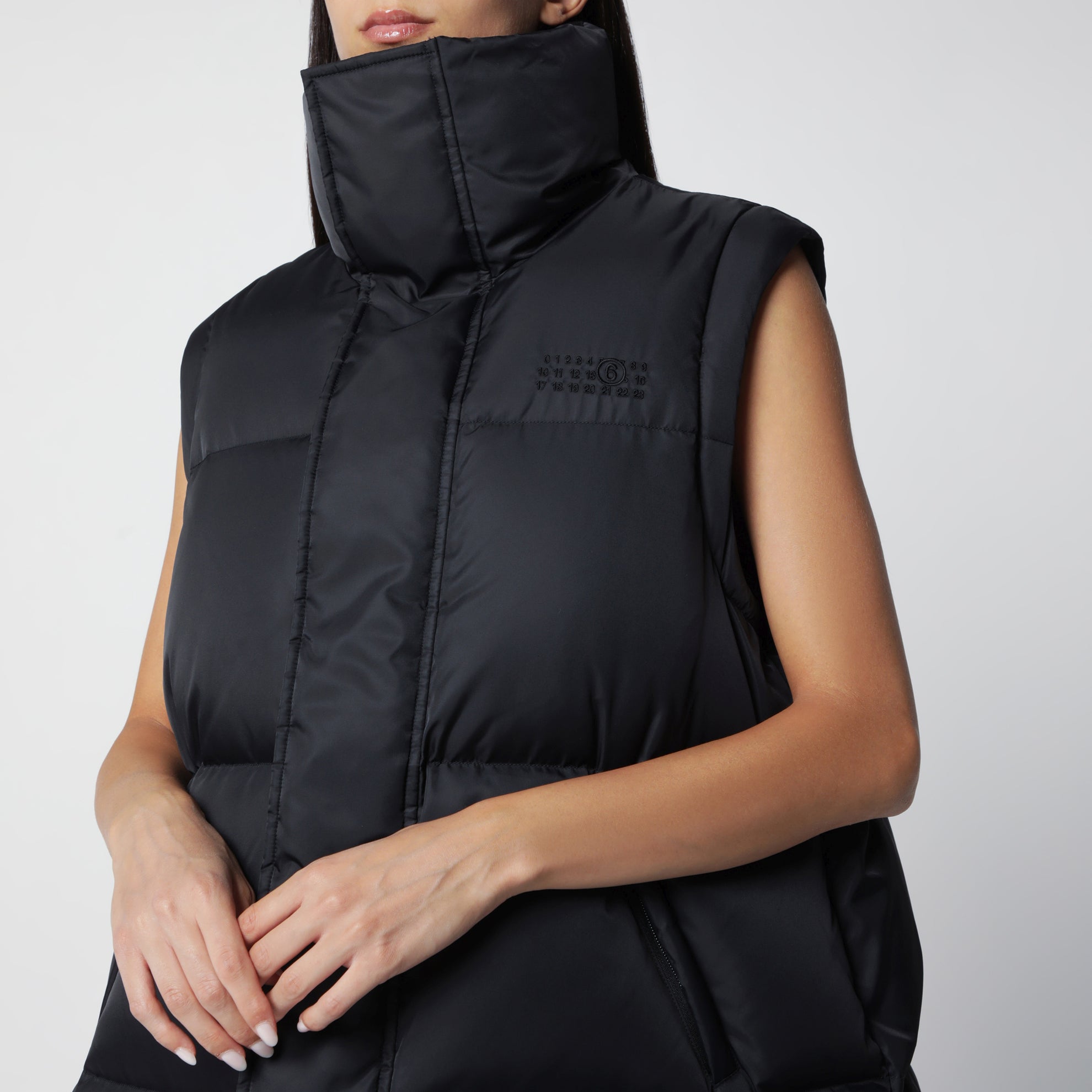 Nylon puffer jacket with detachable sleeves in black