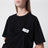 T-shirt noir drapé avec patch logo