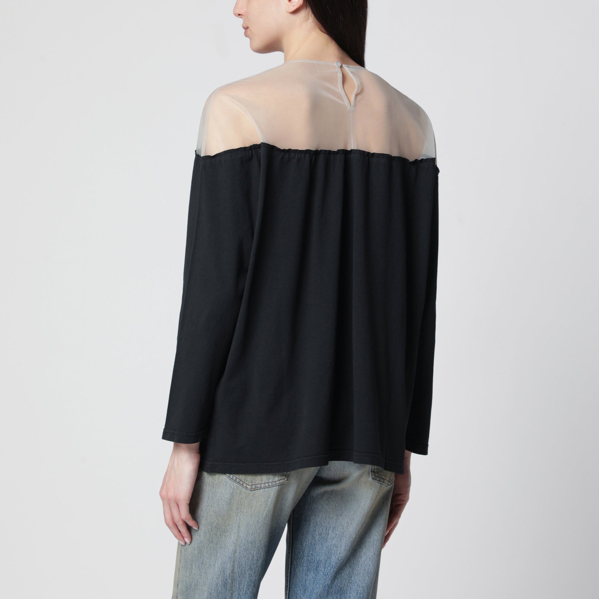 Black top with logo print and sheer insert