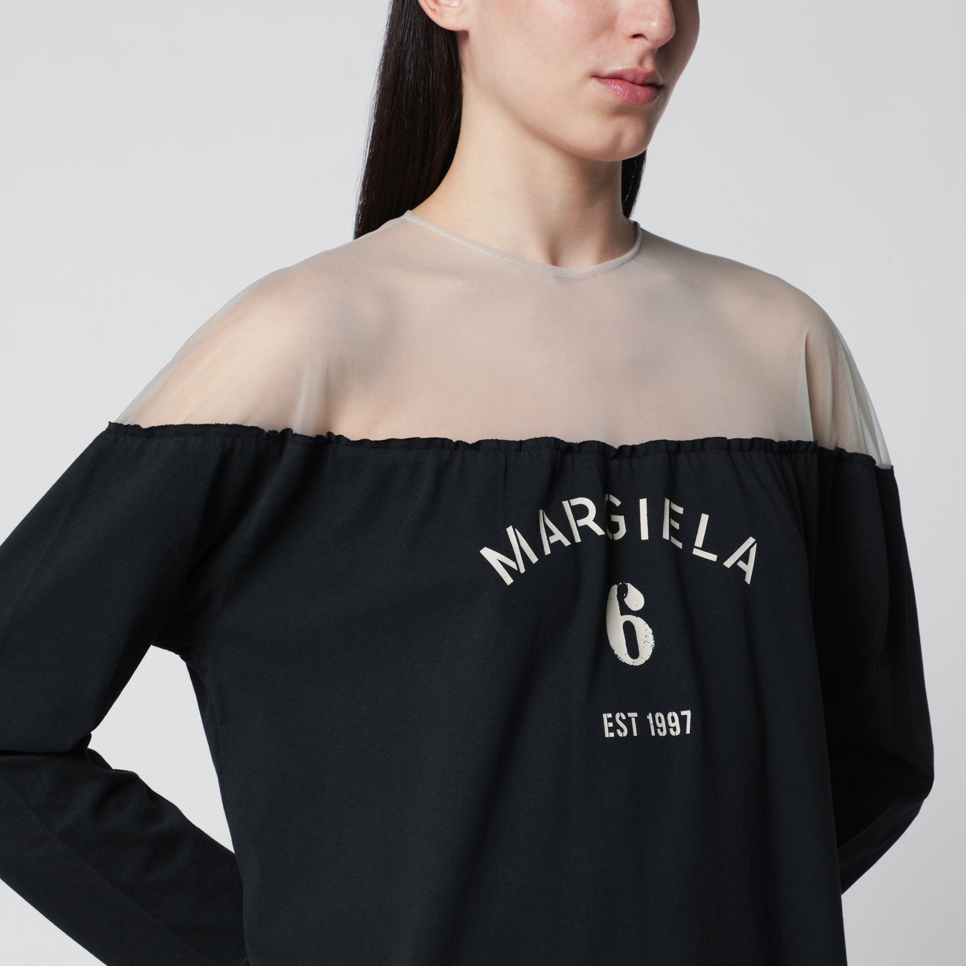 Black top with logo print and sheer insert