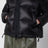 Black down jacket with asymmetrical zip