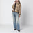 Piumino con zip asimmetrica beige