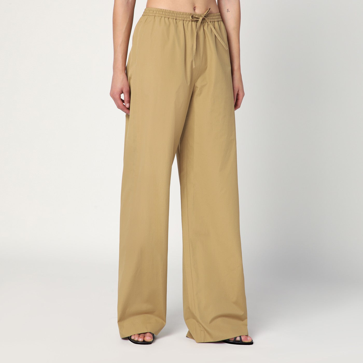 Sand-coloured trousers in cotton