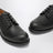 Schwarze Schnürschuhe aus Leder
