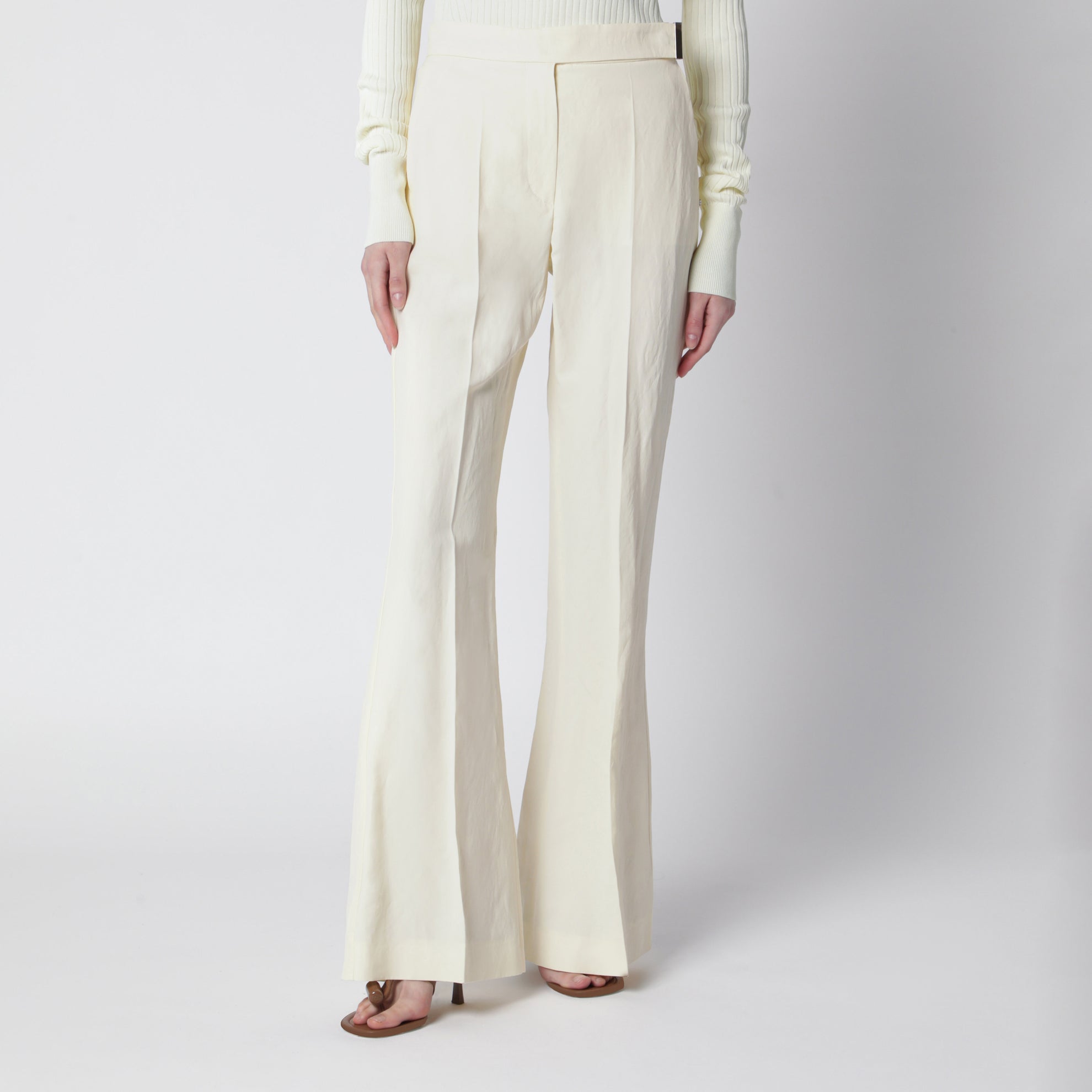 Pantalone flare a vita bassa in viscosa e carta tessile
