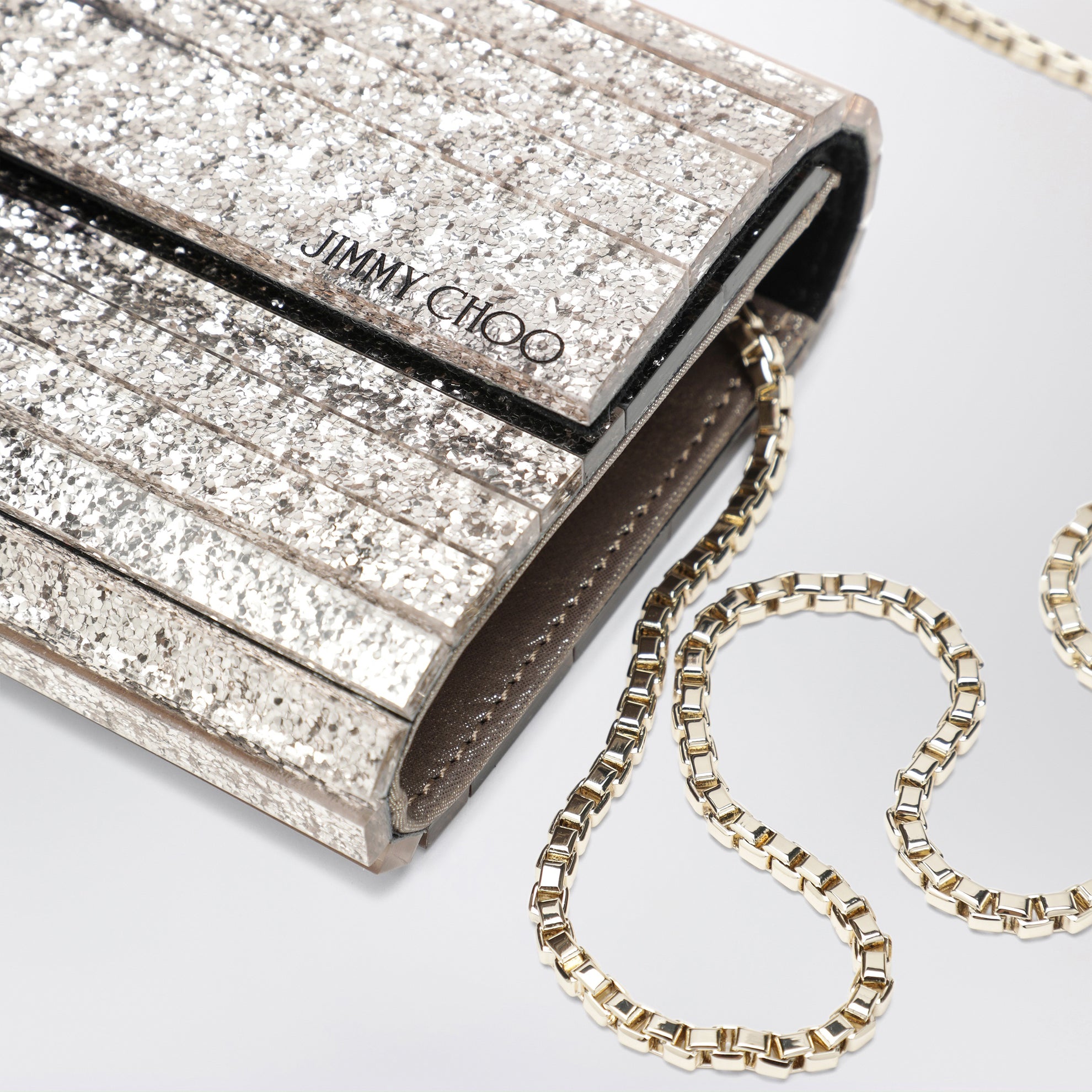 Pochette Sweetie in tessuto glitter dégradé nera/champagne