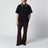 Black piqué polo shirt with embroidered butterfly